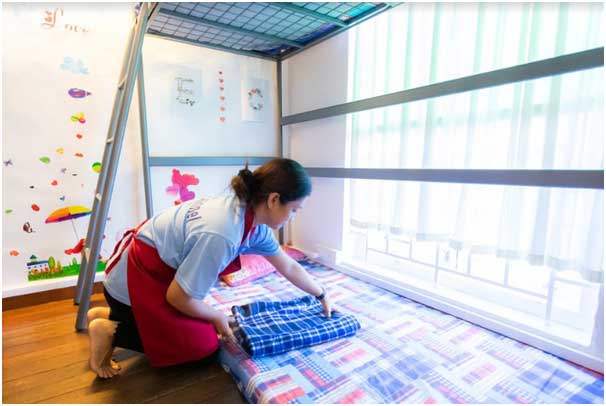 a transfer maid demonstrating her skill in doing household chores